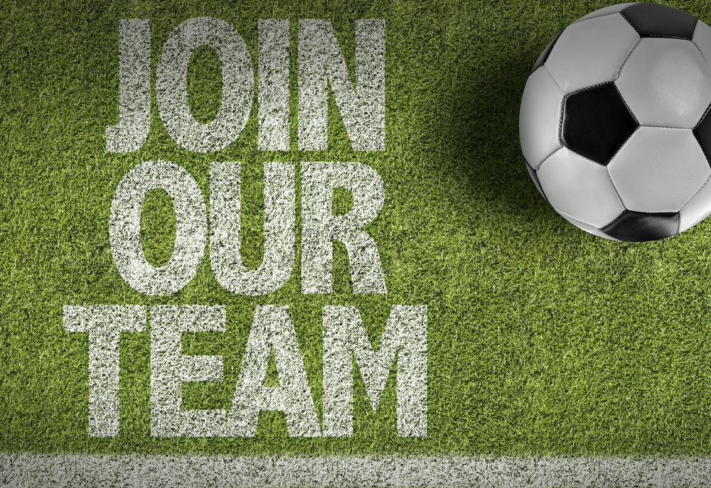 football on grass with join our team text